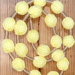 Decorate barren walls! White & yellow garland